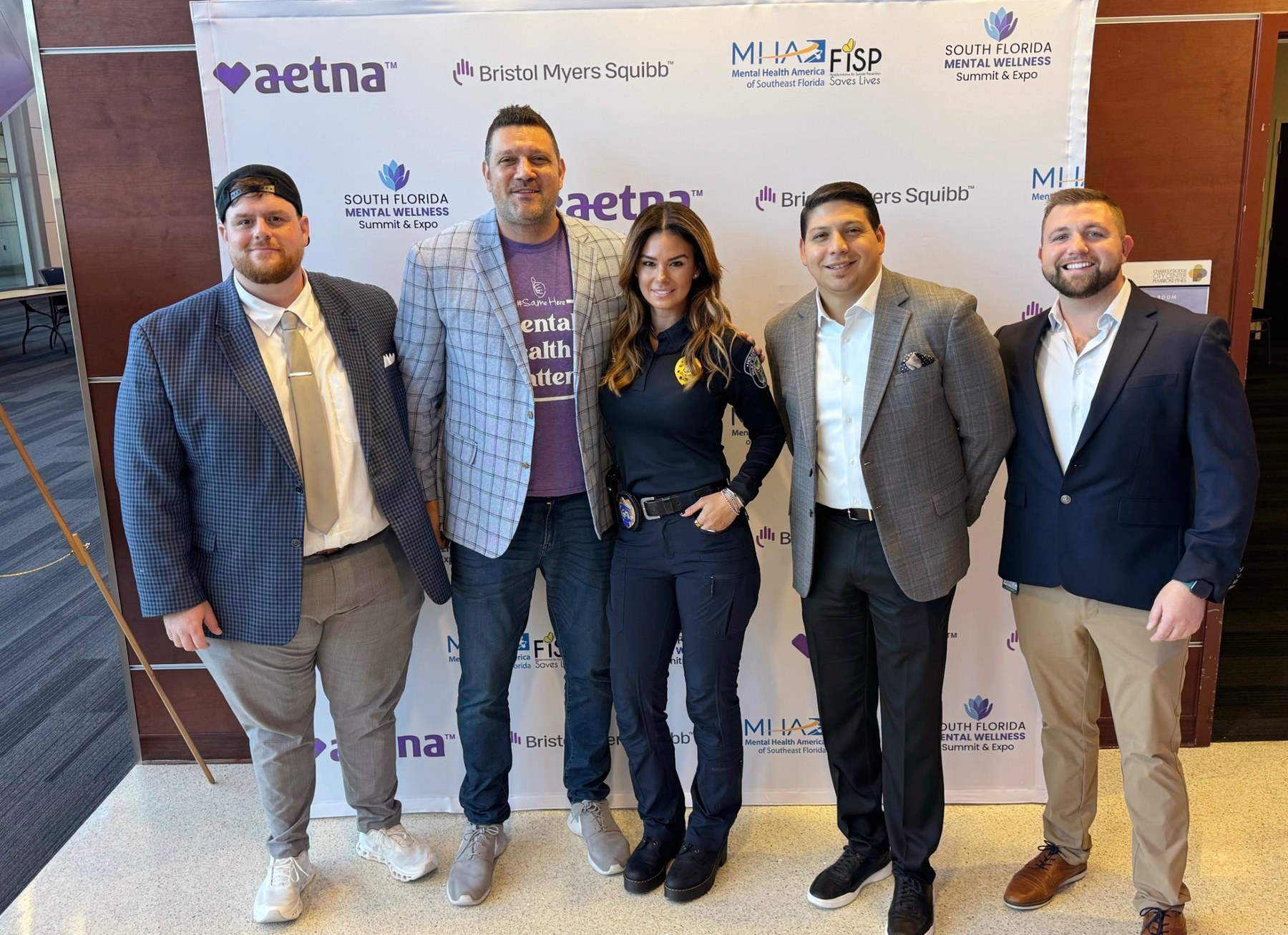 Group photo at summit sponsor step-and-repeat